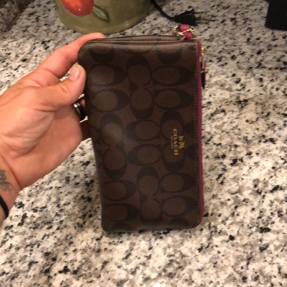 Slightly used Coach wallet with purple trim